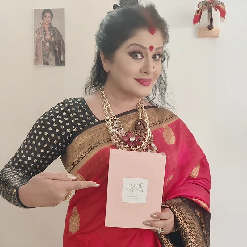 Sudha Chandran holding a HairOriginals box